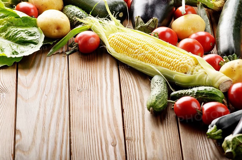 Fresh Organic Vegetable Food Ingredients on Wooden kitchen table background. Space for text