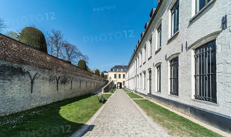 Ixelles, Brussels, Belgium, 03 30 2019: Panoramic ultra wide view over the park and site of the La Cambre Abbey during a sunny spring day, Europe