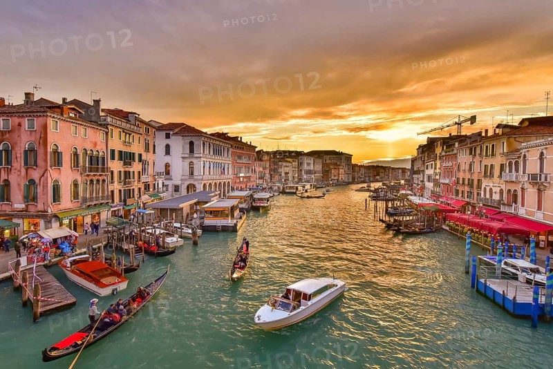 The Grand Canal with gondola and vaporetto at sunset time, Venice, Italy, Europe
