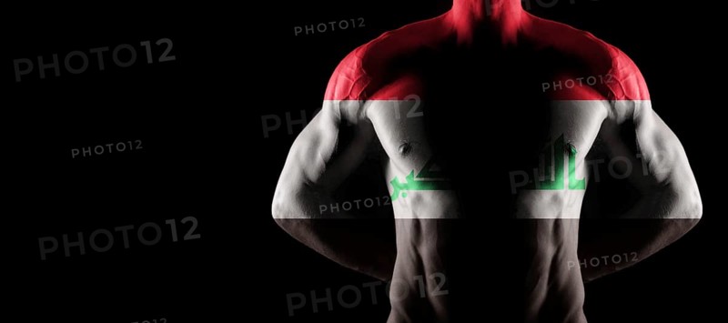 Iraq flag on muscled male torso with abs, black background