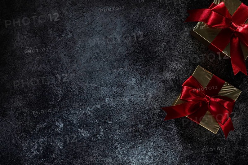 Two Golden Gift Boxes On Dark Background With Copy Space