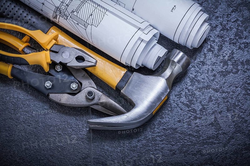 Construction drawings steel cutter pliers claw hammer on black background
