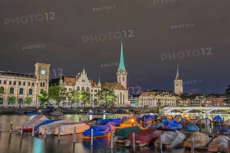 Zurich Switzerland, night city skyline at Fraumunster Church and Munster Bridge