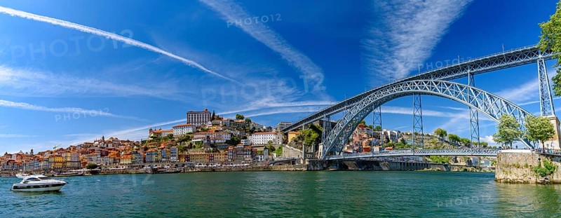 Panorama of the riverbank of Ribeira District and Dom Luis I Bridge in Porto, Portugal, Europe