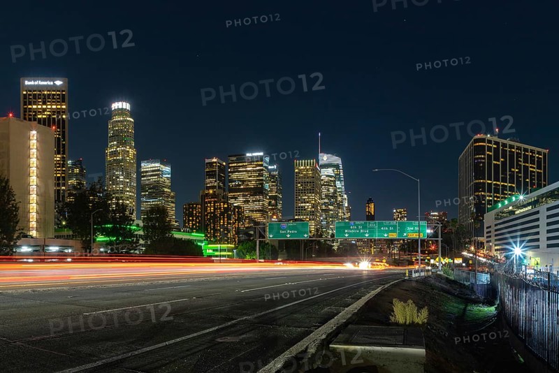 A picture of Downtown Los Angeles and the Harbor Freeway's traffic lights at night