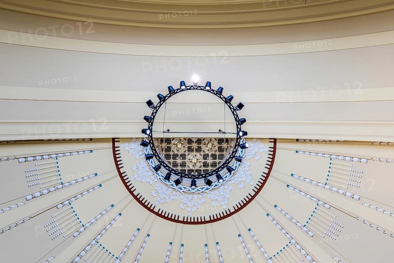 View to the ceiling of a building with modern chandelier and geometric patterns, Prague, Railway station, Historical