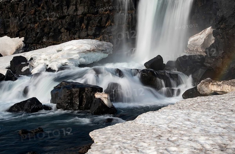 Water from waterfall splashing on a rocky river. The Oxararfoss waterfall in pingvellir Thingvellir national Park iceland