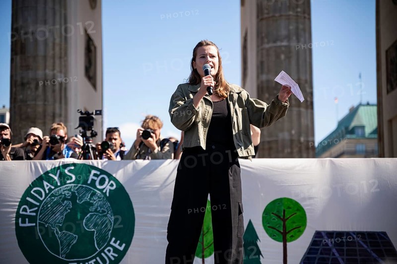 15/09/2023, Berlin, Germany, Europe, German climate protection activist Luisa Neubauer during her speech on a stage in front of the Brandenburg Tor in Berlin's Mitte district at the global climate strike organised by the Fridays for Future movement under the motto, Europe