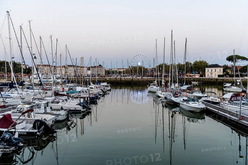 La Rochelle, France, August 6, 2018: The old port. Enclosed by its medieval towers, the picturesque harbour is now lined with seafood restaurants and bars, Europe