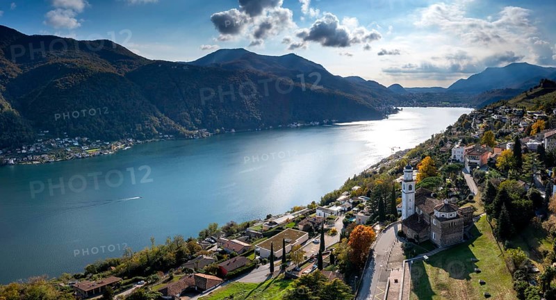 An aerial panorama view of Vico Morcote village and Lake Lugano in southern Switzerland