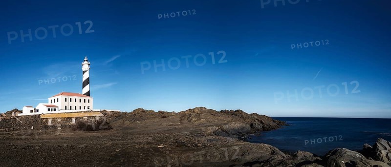 A panorama landscape of the Favaritx Lighthouse on the west coast of Menorca