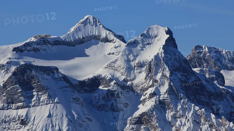 Snow covered peak of mount Uri Rotstock, Swiss Alps