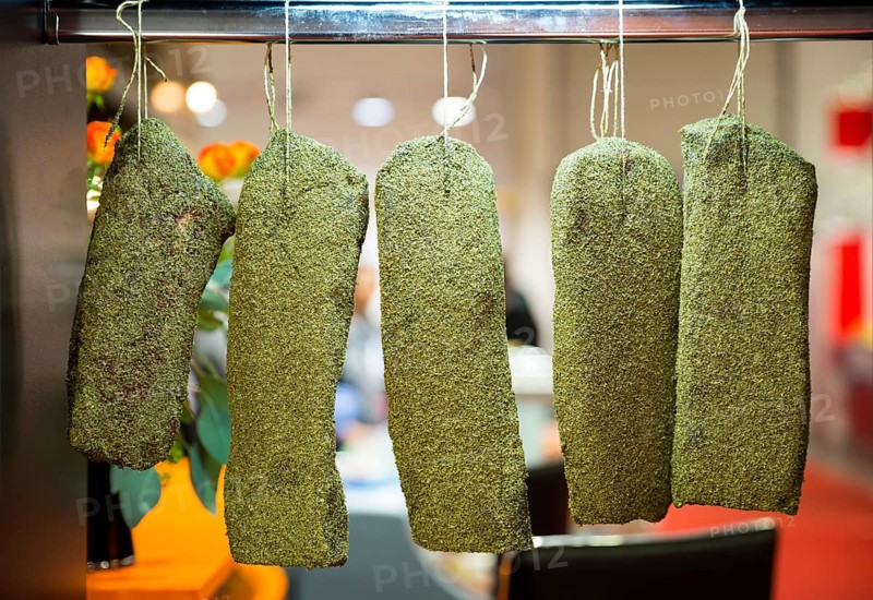 Dried green beef jerky is shown at a food and drink exhibition