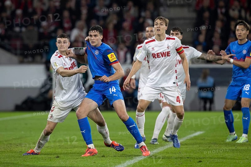 Eric Martel (1.FC Köln, Midfield, #6), Max Geschwill (Defence, Holstein Kiel, #14), DFB Pokal: 1.FC Köln, Holstein Kiel on 29/10/2024 at the RheinEnergieStadion in Cologne Germany . (DFL/DFB REGULATES PROHIBIT ANY USE OF PHOTOGRAPHS AS IMAGE SEQUENCES AND/OR QUASI-VIDEO), RheinEnergieStadion, Cologne, North Rhine-Westphalia, Germany, Europe
