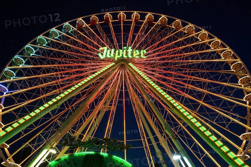 Ferris wheel illuminated at night, perspective, bright lights, many colours, funfair in Bad Arolsen, 9 August 2015, Germany, Europe