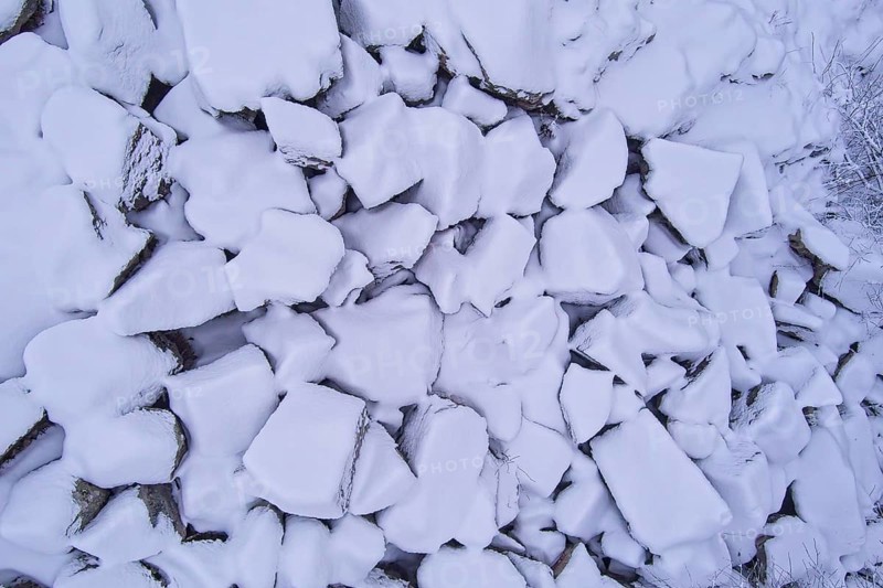Aerial view of pile of large stones covered with snow in winter, Kuhakoski, Nurmijärvi, Finland, Europe