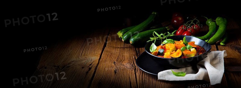 Vegetarian courgette ratatouille with tomato sauce and herbs