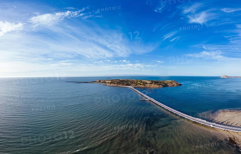 An aerial view of the famous Granite Island Recreation Park and causeway in Victor Harbor on a sunny autumn day in South Australia, Australia, Oceania