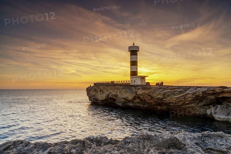A view of the lighthouse at Colonia Sant Jordi in Mallorca at sunset