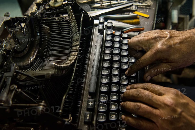Technician repairing an old manual typewriter Mumbai, Maharashtra, India, Asia