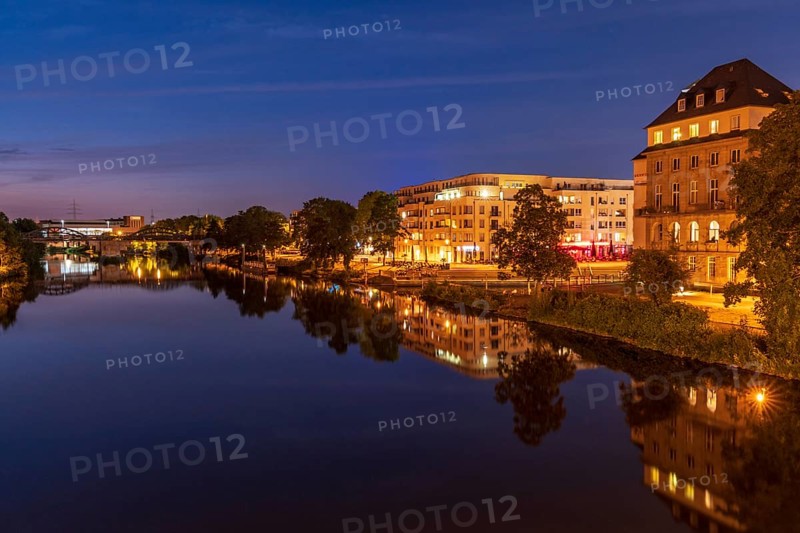 Muelheim an der Ruhr, North Rhine-Westfalia, Germany, July 26, 2018: View over the river Ruhr at night into the city and the Ruhrpromenade, Europe