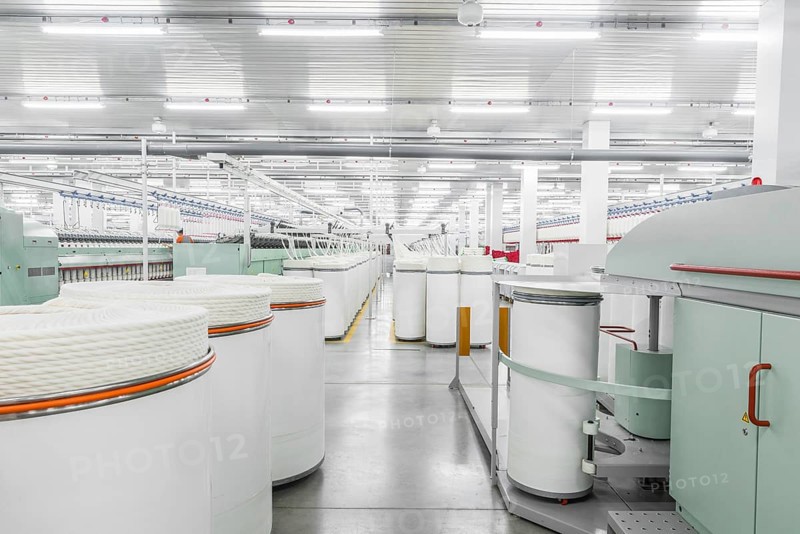 Machinery and equipment in the workshop for the production of thread, overview. interior of industrial textile factory