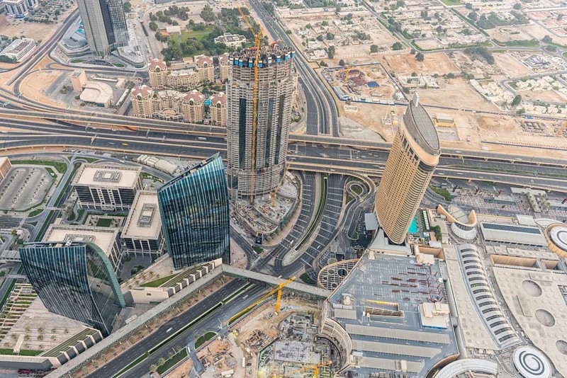 DUBAI, UAE - JANUARY 02, 2015: Dubai downtown sunrise morning scene. Top view from above