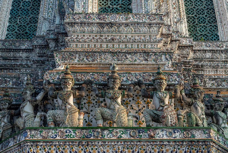 A picture of the statues at the Wat Arun Temple