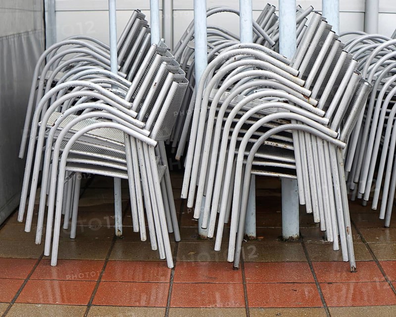 Packed stack of metal chairs