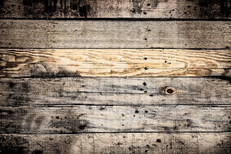 Horizontal wooden planks forming a textured background, weathered and showing knots and grain.Belarus