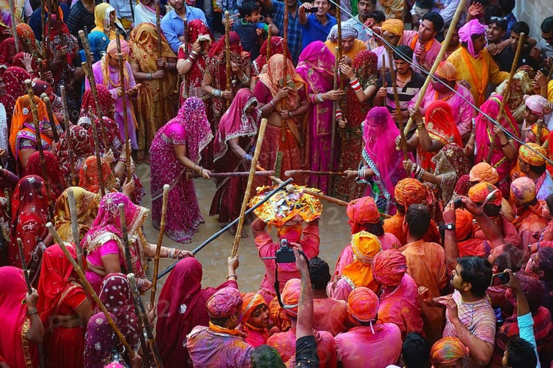 Women beating men with sticks, Lathmar Holi festival, Mathura, Uttar Pradesh, India, Asia