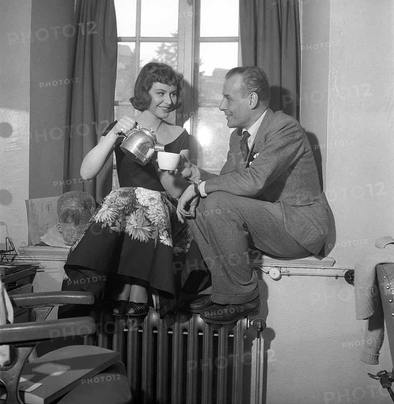 In the 1950s. Actors Maj-Britt Nilsson and Hasse Ekman enjoys a coffee cup during a break when filming a movie. She pours him the coffee from an aluminium coffee pot. Sweden 1953 Kristoffersson Ref BL42-7