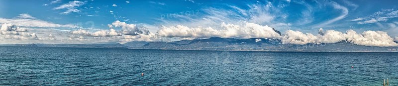 Garda Lake coast on a sunny day with beautiful clouds