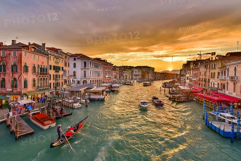 The Grand Canal with gondola and vaporetto at sunset time, Venice, Italy, Europe