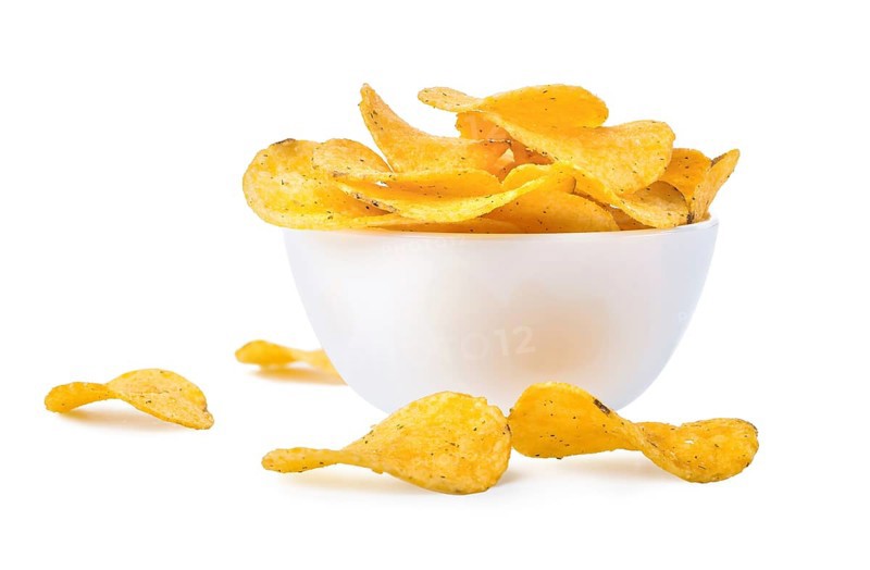 Potato chips in a bowl isolated on a white background