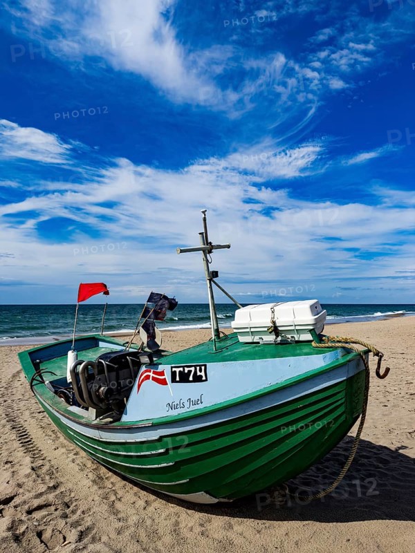 Fishing boat on Stenbjerg beach near Vorupor in Jutland, Denmark, Europe