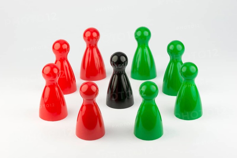 Conceptual game pawns that depict the concept different