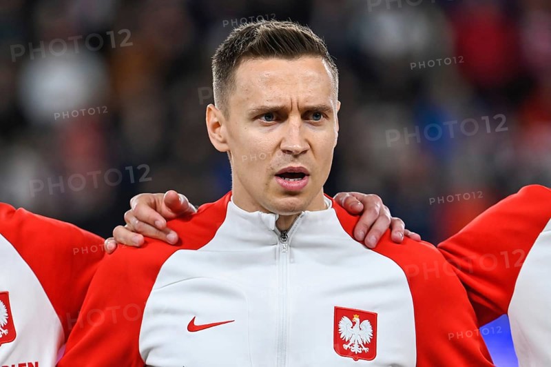 PRAGUE, CZECH REPUBLIC - MARCH 24, 2023: Qualifications for UEFA Euro 2024. Match Czech Republic - Poland 3:1. Przemyslaw Frankowski during anthem.