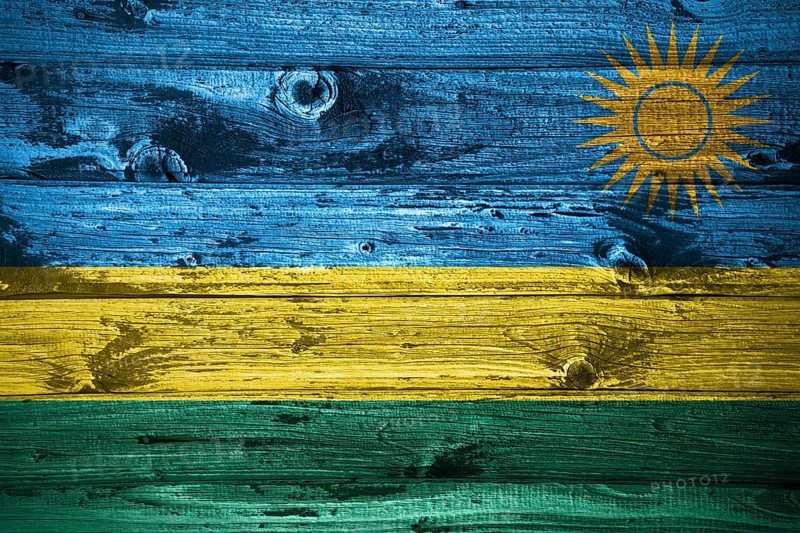 Rwanda flag on wooden planks background wood flag