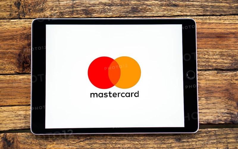 Smart phone with the Mastercard logo that is a brand of credit and debit cards