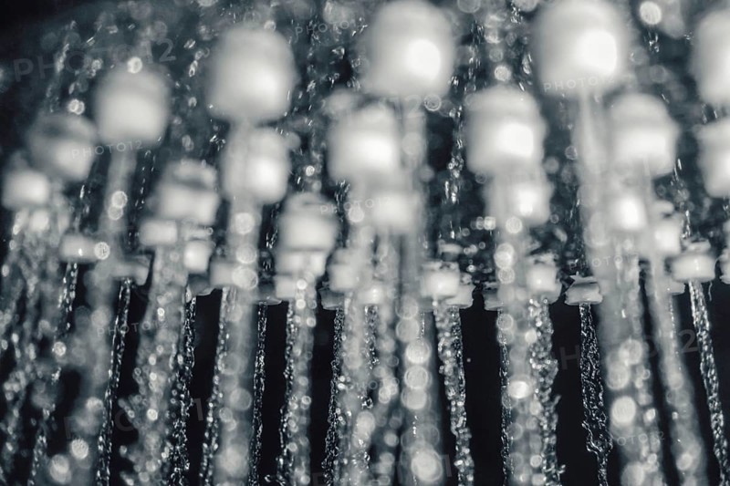 Shower head with running water closeup