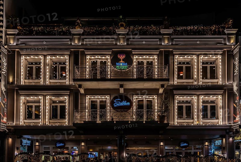 Athens Old Town, Attica, Greece, 12 28 2019, View over the facade of the Taratsa Roofgarden Sabas restaurant and bar by night, Europe