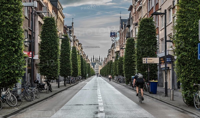 Leuven, Flanders, Belgium, 06 16 2019 Man on a bike driving down the Bondgenotenlaan at the railwaystation, Europe