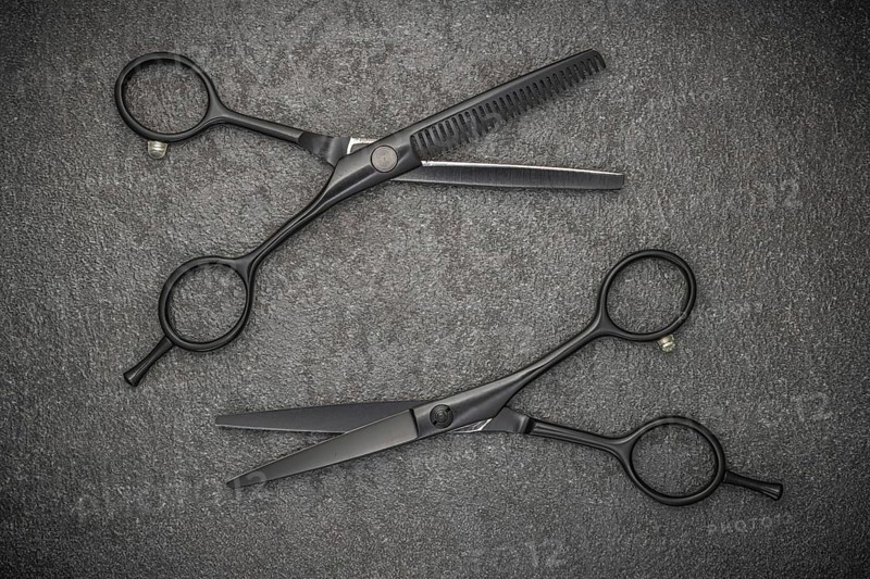 Barber Professional Tools. Haircut Fashion. Pair Of Professional Haircutting Scissors On Black Backgroud