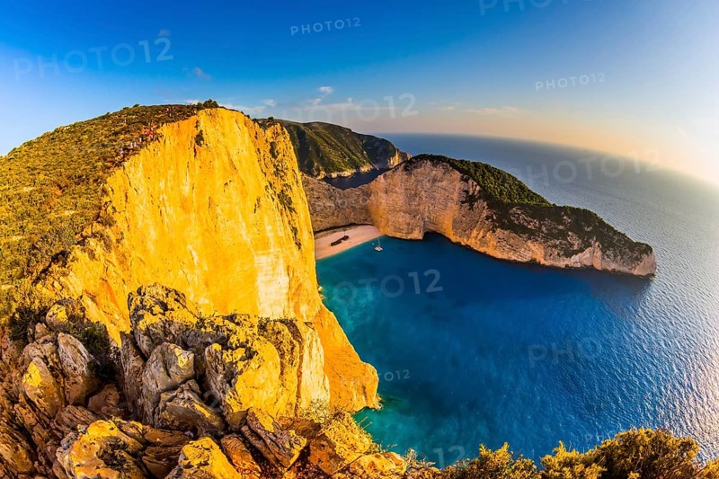 The coast of the Greek island of Zakynthos. Famous Shipwreck Beach. Romantic fabulous sunset. The concept of active, ecological and photo tourism