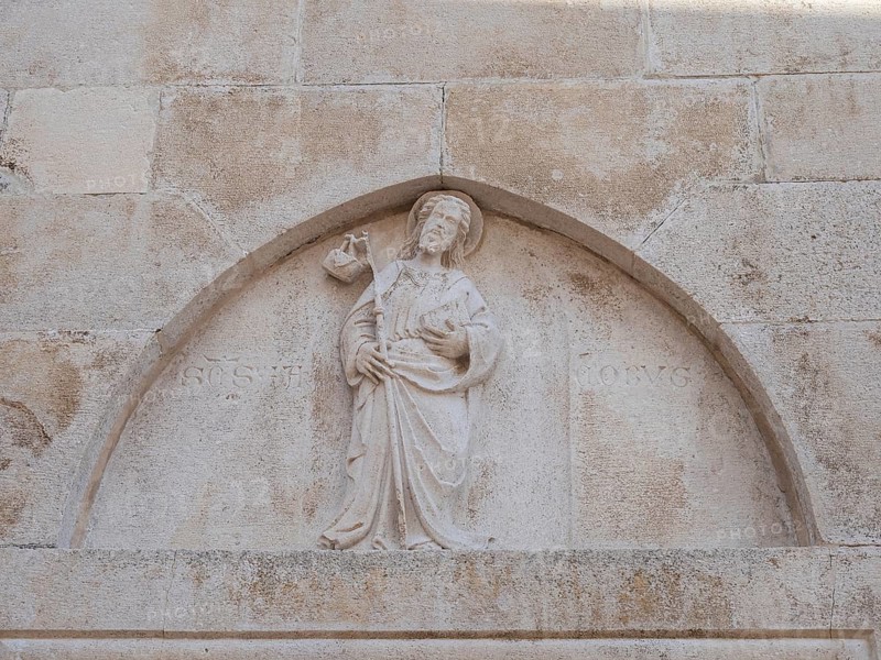 Stone relief on church façade, figure of a saint, old town centre of Korcula, island of Korcula, Dalmatia, Croatia, Europe