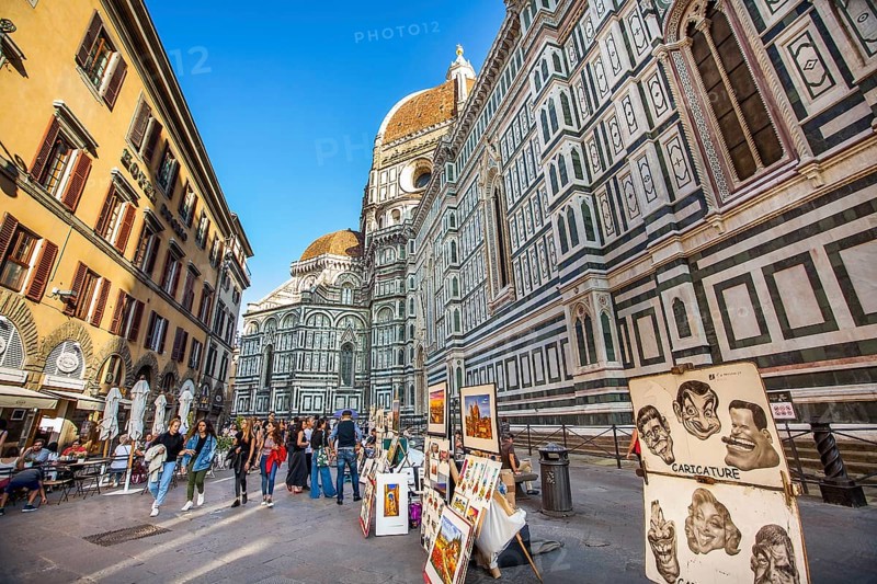 Florence Tuscany Italy on September 30, 2019 Artists exhibit paintings in front of the Duomo in Piazza del Duomo