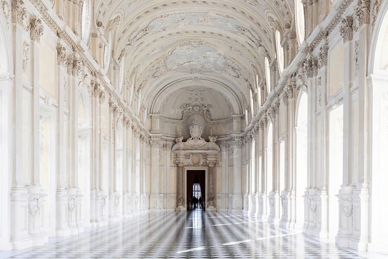 Reggia di Venaria Reale, Italy, October 2022: corridor perspective, luxury marble, gallery and windows, Royal palace, Europe