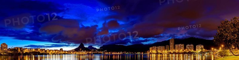 Panoramic image of the first summer night of the year 2018 seen from the lagoon Rodrigo de Freitas with the buildings of the Ipanema and Leblon, Two Brothers hill and Gavea stone on Rio de Janeiro