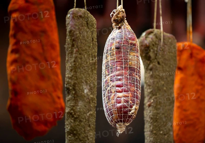 Dried green, brown and orange beef and pork jerky is shown at a food and drink exhibition